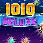 1010 DELUXE라는 텍스트와 다양한 색상의 빛나는 보석들이 있는 이미지