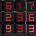 검은색 배경에 빨간색 LED 숫자가 배열된 이미지