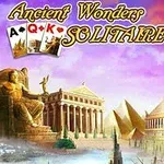 고대 건축물과 조각상이 있는 풍경 위에 카드 뭉치와 Ancient Wonders Solitaire 텍스트가 있는 이미지