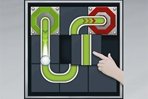 녹색과 빨간색 파이프가 퍼즐처럼 연결되어 있고, 공이 녹색 파이프를 따라가며 손가락이 한 부분을 가리키고 있습니다