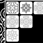 검은 배경에 다양한 패턴이 있는 흰색 사각형 네 개가 배열되어 있습니다