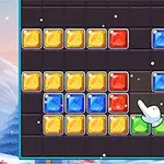 다양한 색상의 블록들이 격자 무늬로 배열된 화면과 배경에 겨울 풍경이 있는 장면