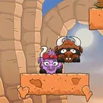 바위 사이에 서 있는 두 개의 만화 스타일의 황소들이 보입니다