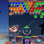 마법사가 다채로운 공을 겨냥하고 쏘는 장면과 어두운 성이 배경으로 있는 이미지