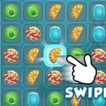 사탕과 크루아상이 있는 퍼즐 게임 화면으로, 손가락으로 스와이프 방향을 가리키고 있음