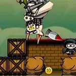 캐릭터가 상자와 모래주머니로 구성된 배경에서 미사일과 로봇을 피하는 장면