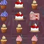 다양한 색상의 컵케이크와 조각 케이크가 정렬되어 있는 이미지