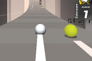 회색 도로 위에 흰색 공과 노란색 공이 나란히 있는 모습