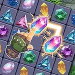 장갑을 낀 손이 다양한 색상의 보석들로 가득한 퍼즐 보드에서 반짝이는 보석 두 개를 연결하고 있다