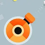 회색 배경 위에 주황색과 검은색으로 구성된 원형 캐논과 노란색 블록이 있으며, 별 모양의 물체가 날아가고 있다