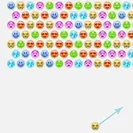 다양한 표정을 가진 색색의 이모티콘이 가득 차 있고, 아래쪽에는 발사되는 이모티콘과 화살표가 있습니다