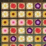 다양한 색상의 꽃들이 격자무늬로 배열된 이미지