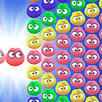 다양한 색상의 눈동자를 가진 둥근 캐릭터들이 빛나는 배경 위에 배열되어 있는 모습