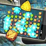 휴대전화 화면에 형형색색의 보석들과 두개골이 함께 표현된 이미지