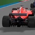 빨간색 포뮬러 자동차가 트랙 위를 주행 중인 모습