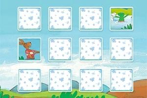 열두 개의 카드가 정렬된 가운데 두 장의 카드가 뒤집혀 다양한 그림이 보이며, 배경에는 파란 하늘과 언덕이 있습니다