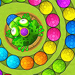 중앙에 개구리가 있고 다채로운 색상의 공들이 원형으로 배치된 모습