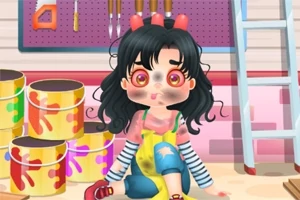 페인트 깡통과 사다리 옆에 앉아 있는 페인트 묻은 소녀