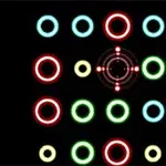 검은 배경 위에 빨간색, 노란색, 녹색, 하늘색의 광택나는 원과 원형 무늬가 배열되어 있다