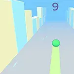 회색 도로 위에 녹색 공이 굴러가고 있으며, 양옆으로 노란색과 파란색의 높은 건물들이 있습니다