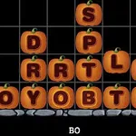 호박 모양의 타일에 영문 알파벳이 적혀 있는 퍼즐 게임 화면