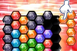 다양한 색상의 육각형 블록들이 배열되어 있고 손가락이 오른쪽에서 블록을 가리키는 모습