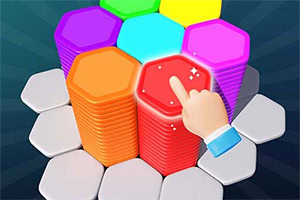 다양한 색상의 육각형 타일 더미 위에 손가락이 놓여 있는 이미지