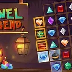 나무 배경에 다양한 색상의 보석들이 놓여 있고, Jewel Legend라는 글씨가 있는 이미지
