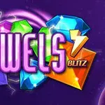 보라색 배경 위에 다양한 색상의 보석과 JEWELS BLITZ라는 텍스트가 있는 이미지