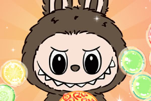 귀여운 갈색 털을 가진 동물이 과일 모양 사탕 주위에 있는 모습