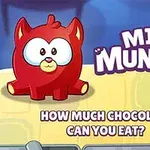 빨간색 만화 캐릭터와 MINI MUNCHER라는 텍스트가 있으며, 배경에는 초콜릿이 있는 이미지