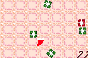 초록색과 빨간색 블록들이 반복되는 패턴 배경 위에 배치되어 있는 이미지