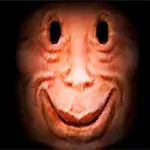 어둠 속에서 환하게 웃고 있는 흉상 형태의 얼굴