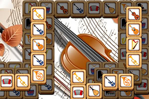 음악 악기 아이콘이 그려진 타일들이 큰 바이올린 이미지와 악보 위에 배열되어 있는 장면