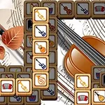 음악 악기 아이콘이 그려진 타일들이 큰 바이올린 이미지와 악보 위에 배열되어 있는 장면