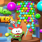 녹색 캐릭터가 다채로운 공들로 채워진 탑 옆에 있는 모습