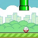 초록색 파이프가 하늘에서 내려오고, 웃는 표정을 지닌 공이 녹색 잔디 위에 있는 장면