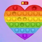 무지개 색상의 하트 모양 푸시팝 장난감이 화면에 표시되어 있습니다