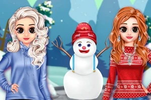 눈 덮인 배경 앞에 서 있는 두 여성과 눈사람