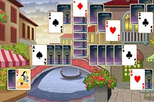 다양한 카드가 펼쳐져 있고 배경에는 다리와 운하가 있는 그림