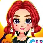 빨간 머리를 가진 소녀가 할로윈 귀걸이를 하고 있으며, 배경에 거미와 박쥐가 있는 모습