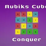 보라색 배경에 3x3 그리드로 배열된 빨강, 파랑, 노랑, 초록색 타일과 Rubiks Cube Conquer라는 텍스트