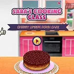 주방에서 엄지손가락을 치켜든 캐릭터와 체리 케이크가 탁자 위에 놓인 모습