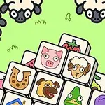 녹색 배경 위에 양과 여러 동물, 물건이 그려진 타일들이 쌓여 있는 이미지