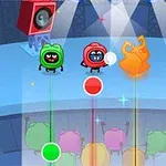 무대 위에서 세 개의 만화 캐릭터가 조명 아래 서 있고, 앞쪽에는 색색의 원과 선이 배열되어 있다