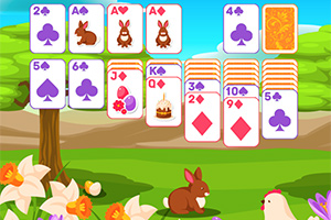 초원 배경에 놓인 카드 게임 이미지와 나무, 꽃 주위에서 토끼와 닭이 있는 풍경