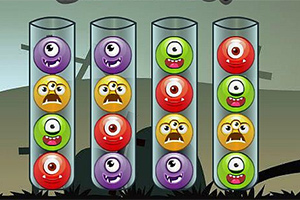 4개의 투명한 관에 각기 다른 색깔의 외눈박이 몬스터 얼굴이 들어가 있는 이미지