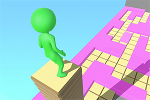 녹색 캐릭터가 탑 위에 서서 분홍색과 노란색 타일 길을 바라보는 모습