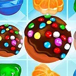 다양한 색상의 사탕과 초콜릿이 눈에 띄는 밝은 배경의 이미지