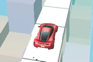 빨간 차가 높은 건물 사이의 흰색 도로를 달리고 있는 모습